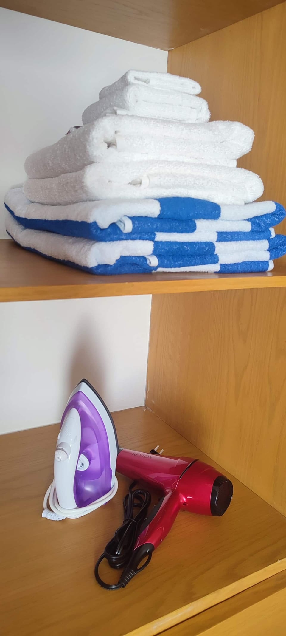 Beach and bath towels, iron and hair dryer
