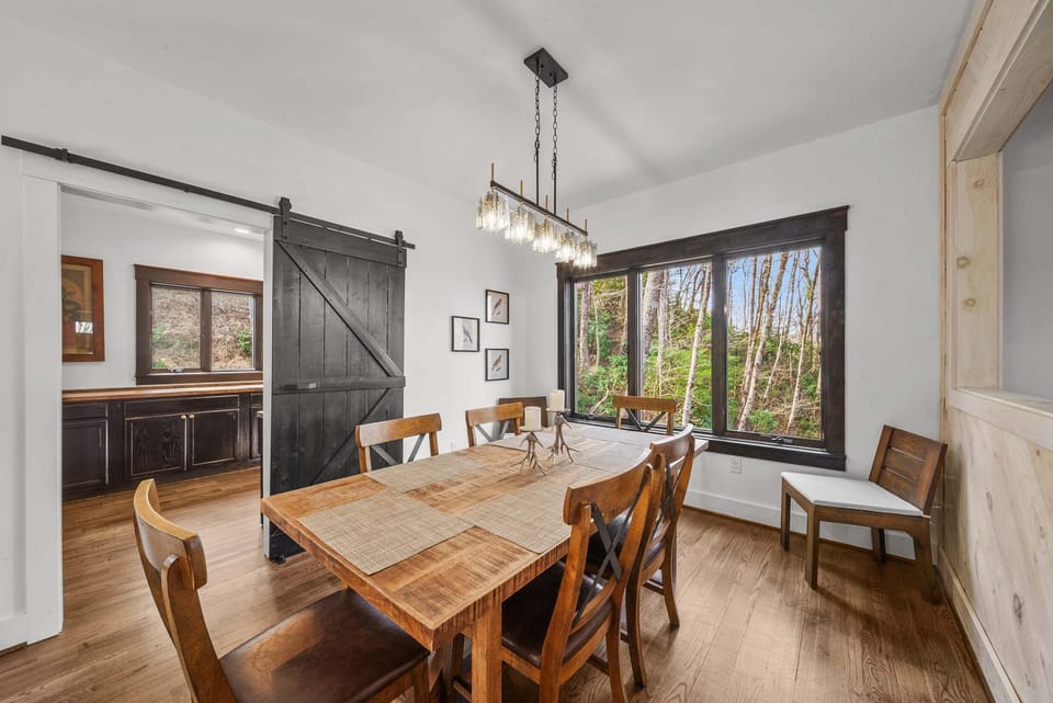 Wood Dining Table, Mountain Scenery and Modern Lighting