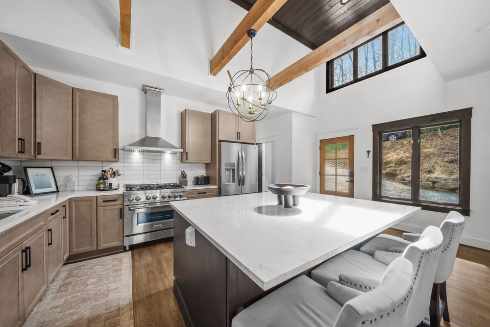 Spacious Modern Kitchen with Quartzite Counters, Gas Stove and Island Seating