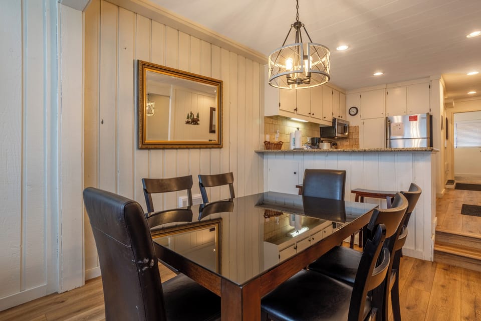 Dining table opens to kitchen.