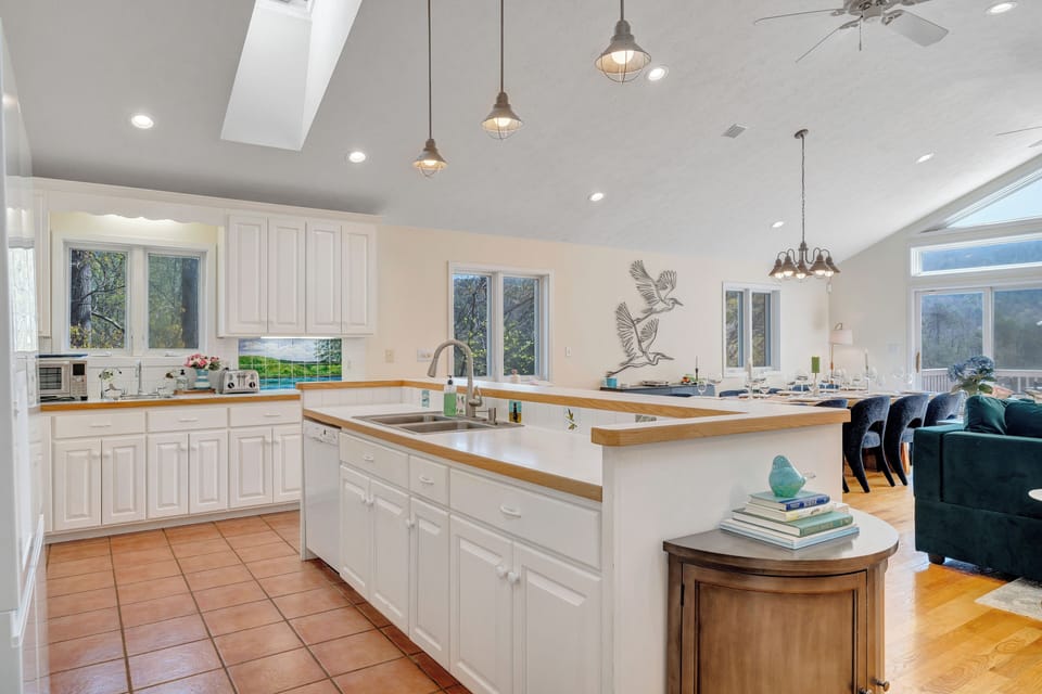 Upper level open floor plan kitchen with main sink and secondary sink