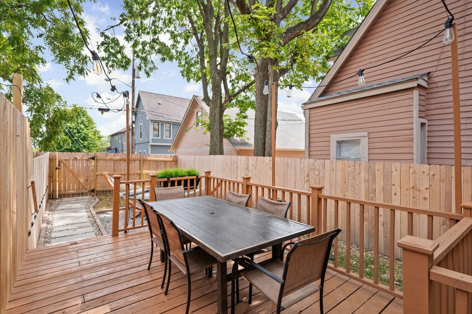 Step outside to your private deck for dinner, drinks, and easy evenings under the trees and cafe lights.