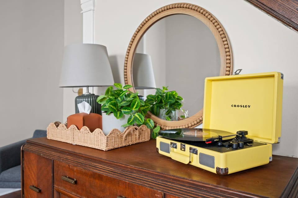 Chic vintage-inspired decor with record player and warm designer touches