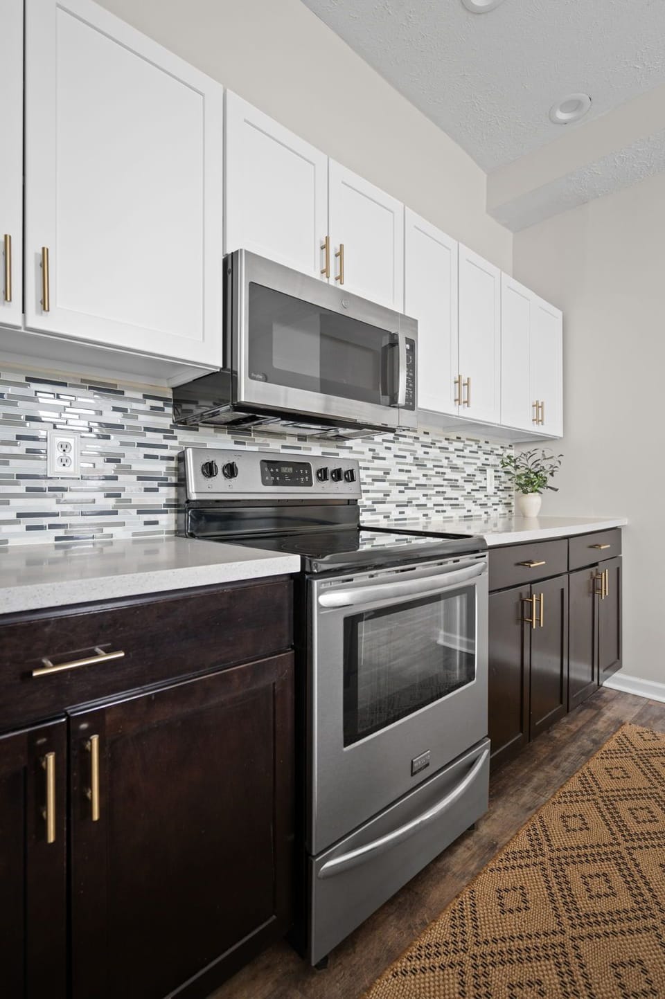 Modern kitchen with stainless steel appliances and stylish tile backsplash