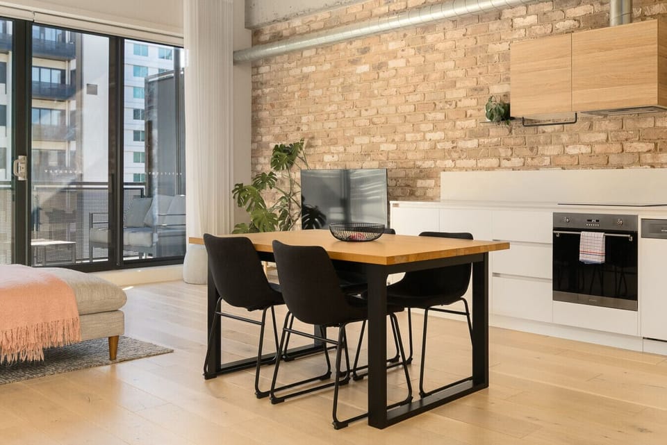 Light-filled dining and kitchen area with contemporary design, ideal for shared meals or a quiet morning coffee.