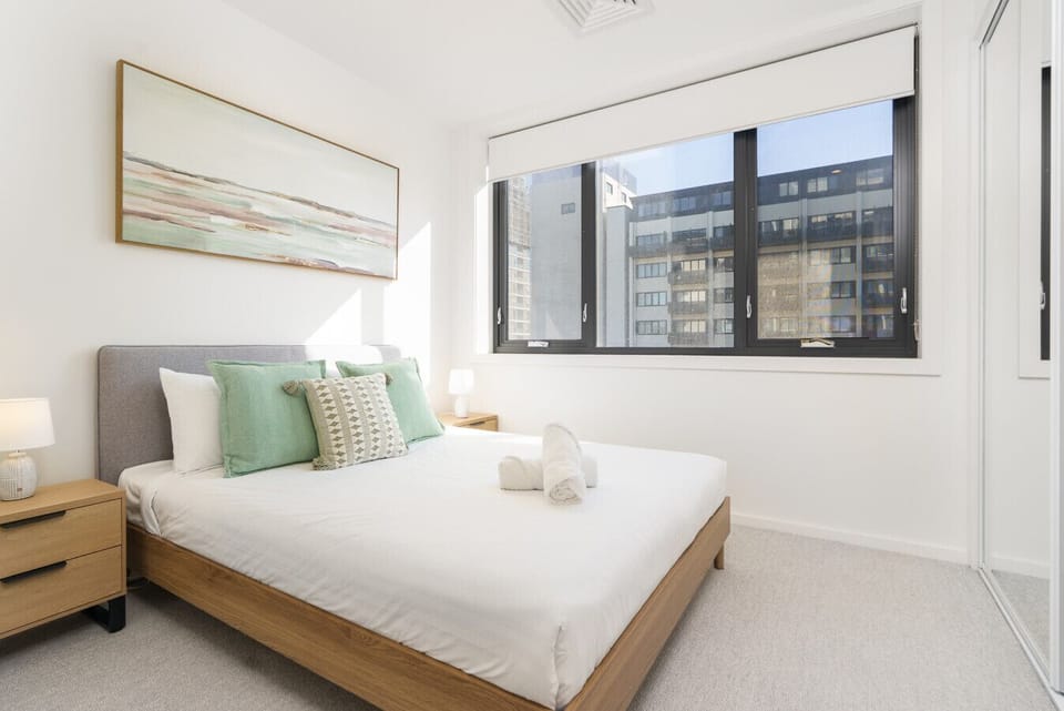 Peaceful bedroom retreat with plush bedding and calming tones for a restful sleep.