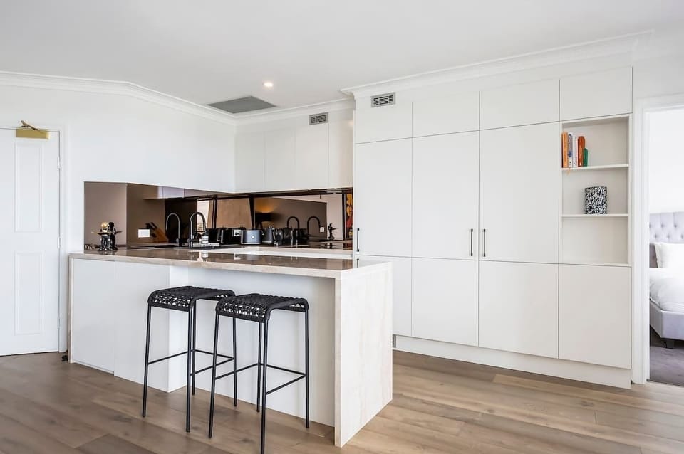 Newly renovated kitchen with Miele oven and induction cooktop.
Integrated dishwasher and liebherr fridge.
