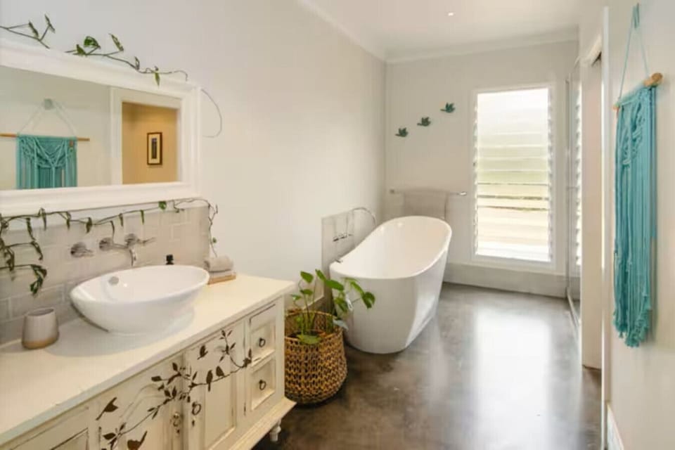 Bathroom with freestanding bath & separate shower with glass door