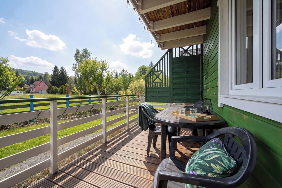 A terrace with outdoor seating and views of the surrounding countryside. A perfect spot to relax and enjoy fresh air.