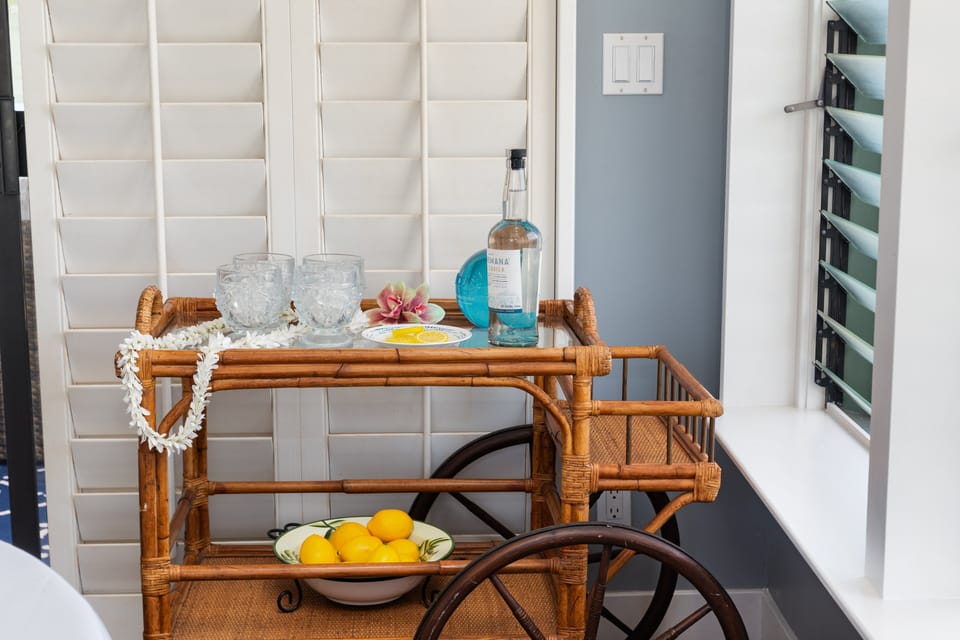 Styled beverage cart adding a welcoming touch near the dining area.