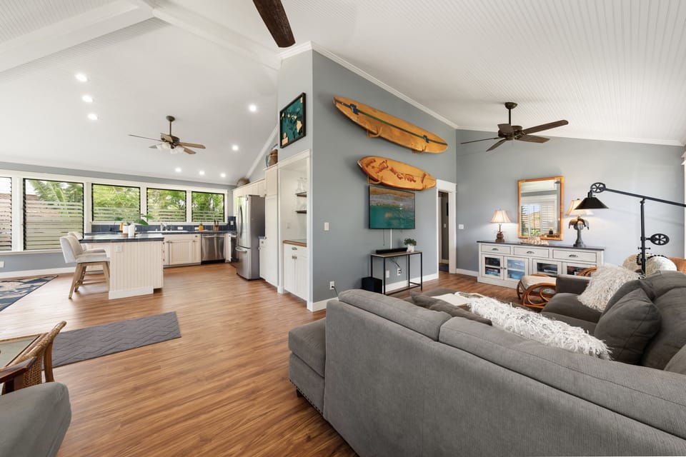 Bright open living room with comfortable seating and easy access to the lanai.