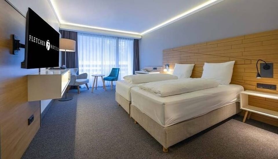 Relax beneath ambient ceiling lights in a sleek modern room.