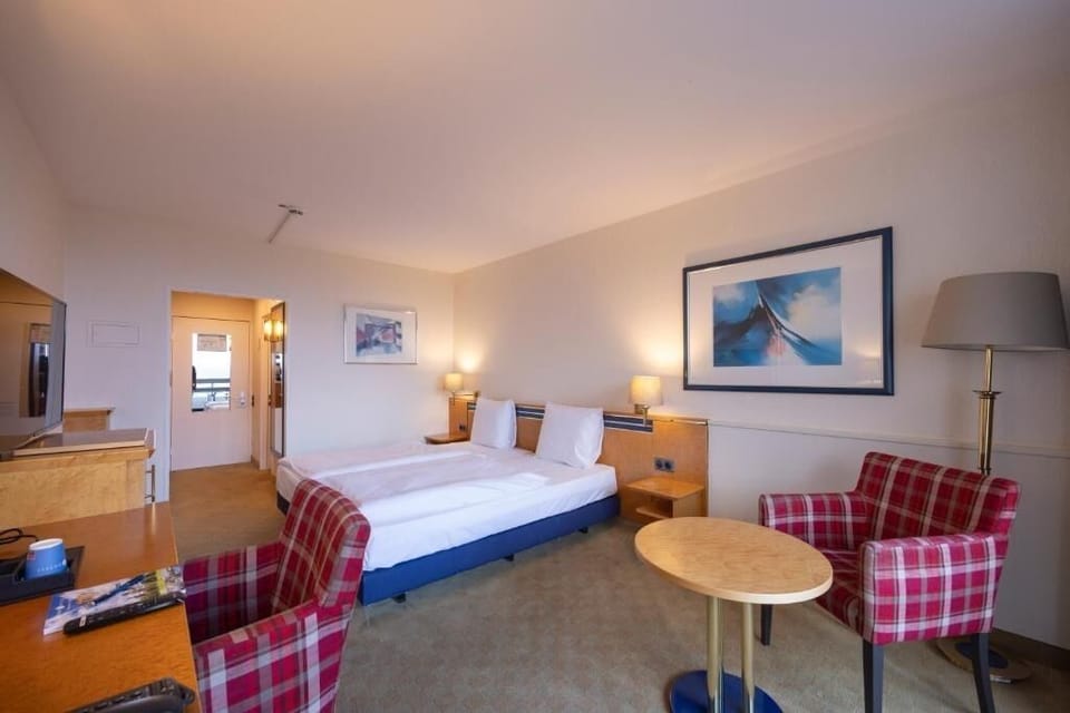 Unwind in a cozy twin room with warm lighting.