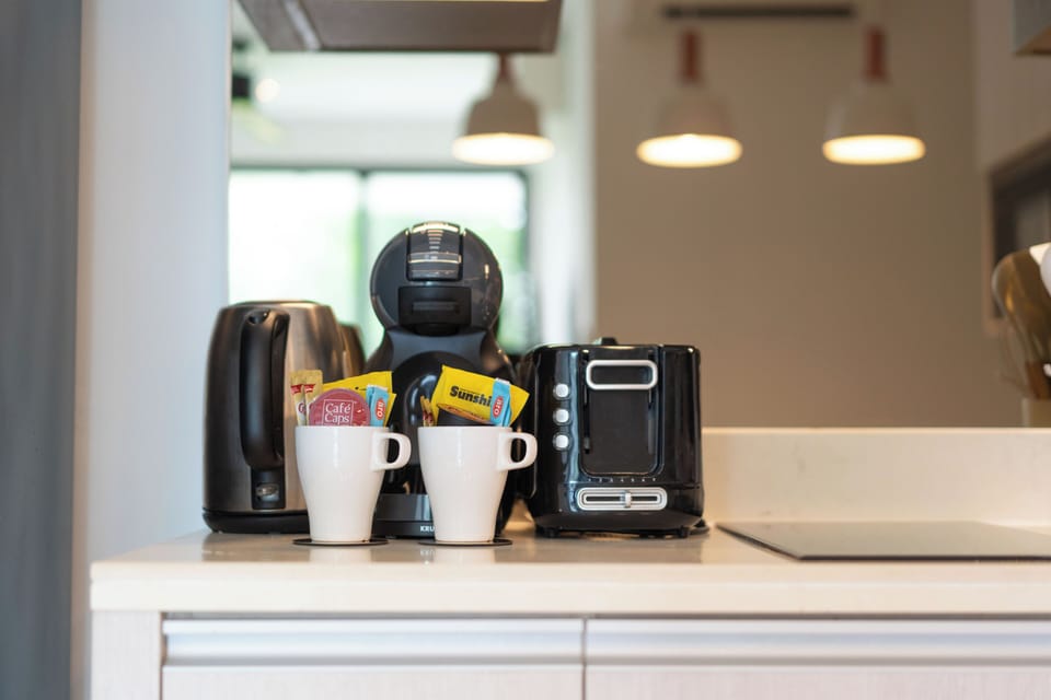 Deluxe Apartment, Balcony, Garden View | Private kitchen | Espresso maker, electric kettle, highchair