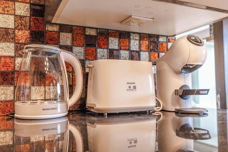 Comfort Apartment, Balcony, Garden View | Private kitchen | Espresso maker, electric kettle, highchair