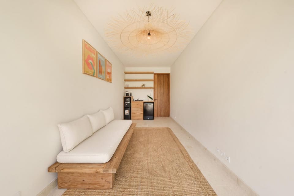 Villa Svara Amed - Cabana day room with a door to the Bunk room and the 4th bathroom