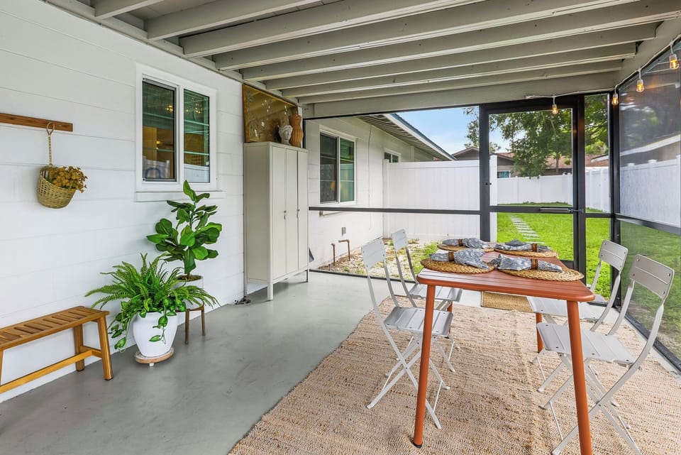 Enjoy dining and relaxing on the spacious private screened-in patio, with a dining area and comfortable lounge seating—perfect for enjoying Florida’s beautiful weather in every season!