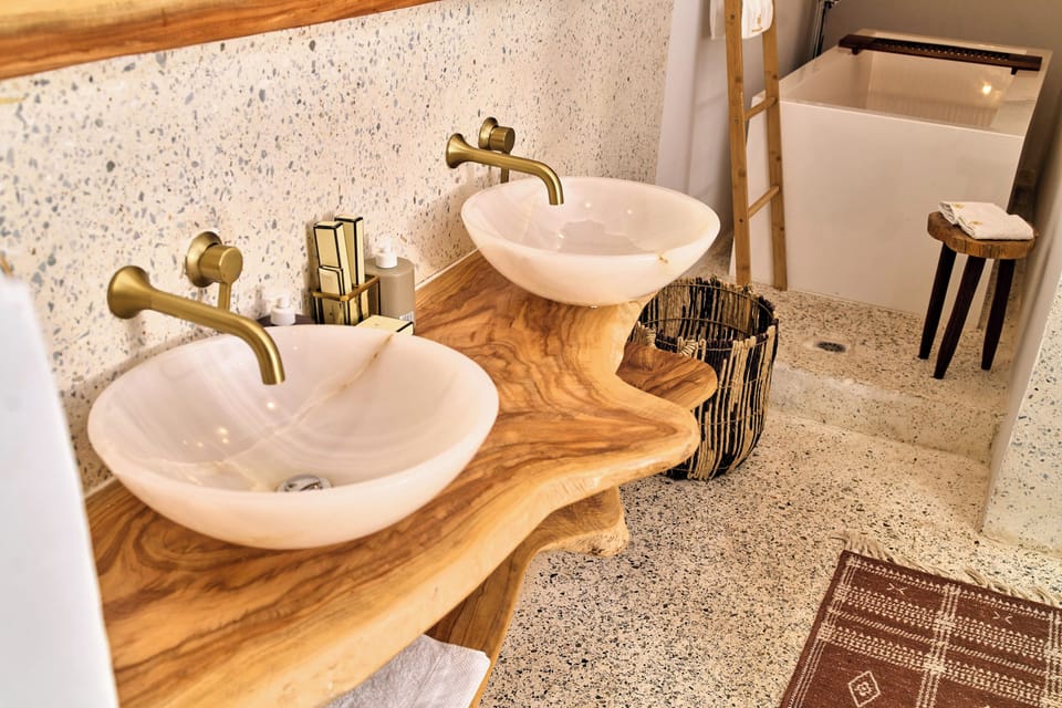 Signature Suite | Bathroom | Hair dryer, slippers, towels, soap
