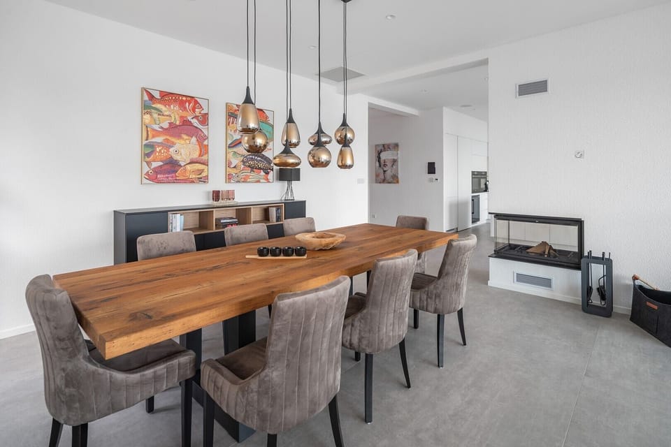 Wrapped in the glow of the hearth and steps away from the kitchen, our dining area sits at the center of it all.
