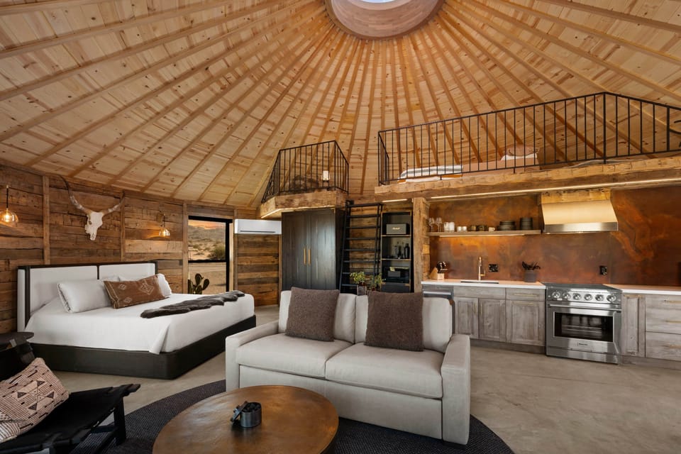 150-yr-old reclaimed beams, vaulted ceiling, retractable dome — fully Restoration Hardware