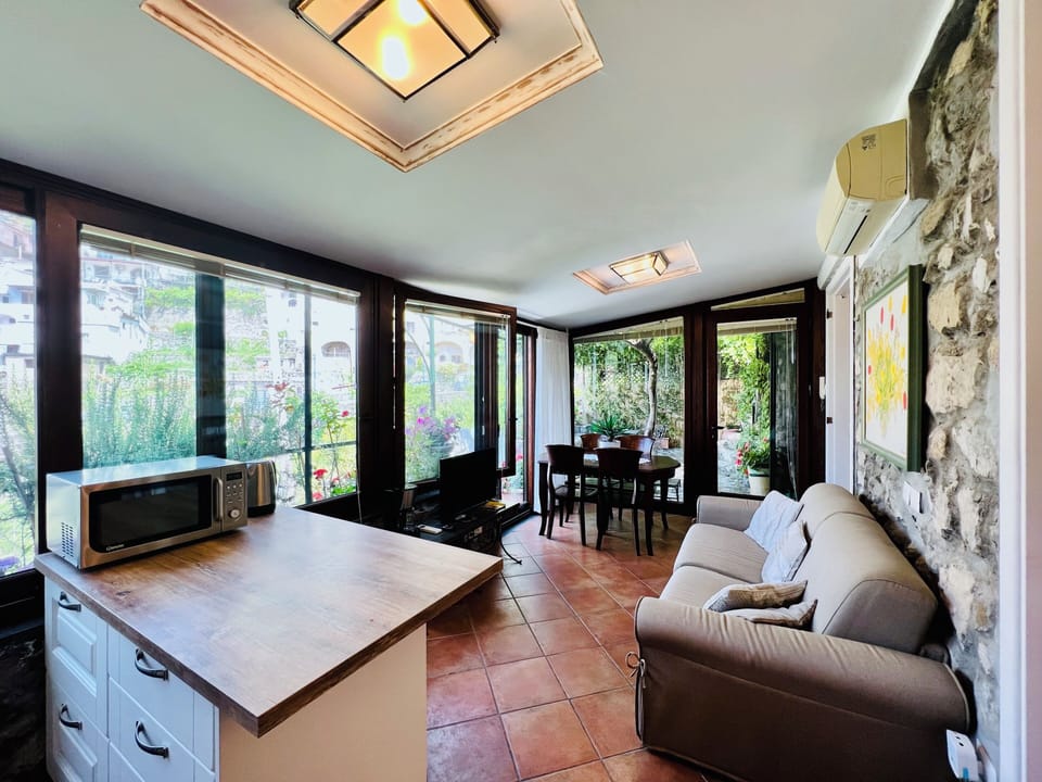 Apartment, 2 Bedrooms, Garden View | Living area | 32-inch flat-screen TV with digital channels
