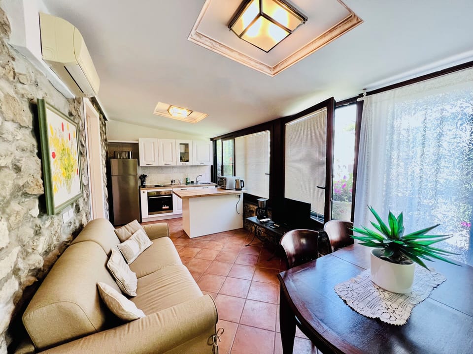 Apartment, 2 Bedrooms, Garden View | Living area | 32-inch flat-screen TV with digital channels