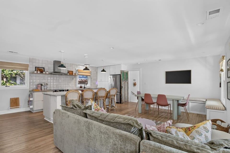 The kind of open, airy space where everyone naturally gravitates - plenty of room to cook together, catch up over dinner, or kick back for movie night with the whole crew