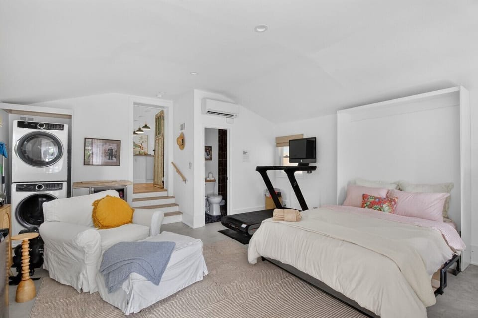 A studio-style suite with your own sitting area, workout space, and plush bedding - perfect when you need a little privacy from the group