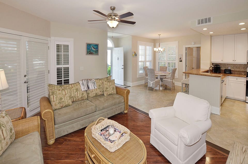 Entry / Living / Kitchen / Dining. Your open-concept sanctuary blends living, dining, and kitchen seamlessly. Sink into coastal comfort while enjoying home-cooked meals and peaceful moments.