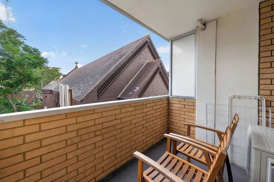 Step onto the private balcony to enjoy fresh air and a peaceful outlook, an ideal spot to start your morning or wind down after a long day exploring the area.