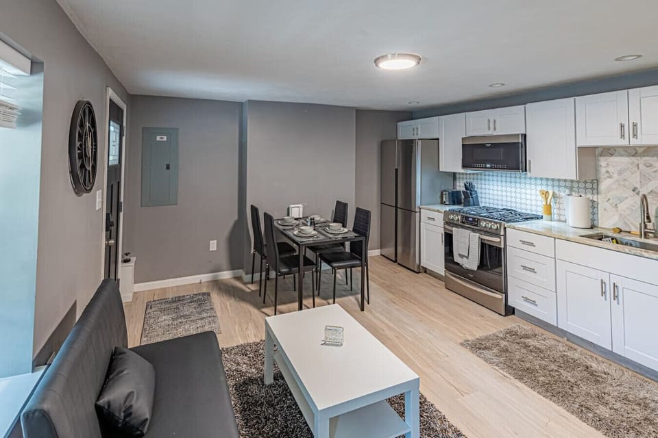 Fully equipped kitchen with cooking essentials, plus a dining area for 4 and a comfortable sofa for relaxing or socialising