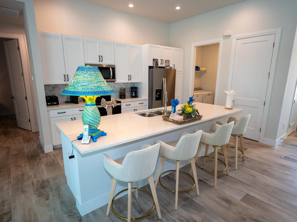 Bright, modern kitchen with spacious island and seating for four