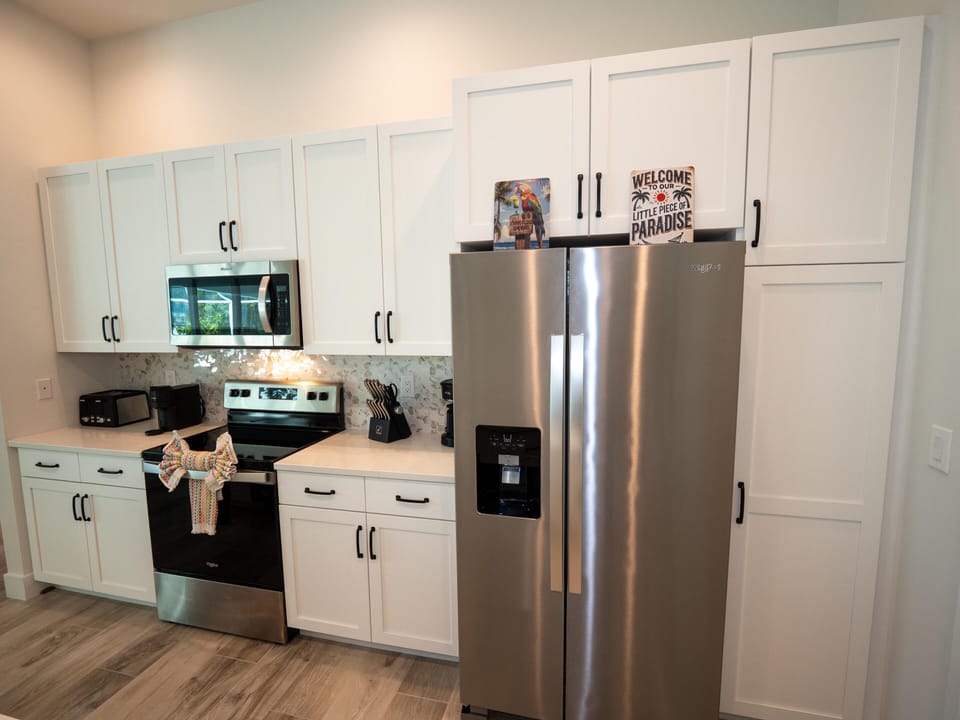 Modern kitchen with stainless steel appliances and ample storage