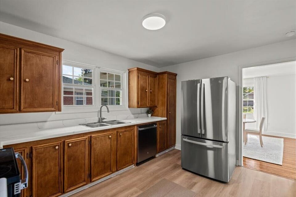 Fully stocked kitchen with stainless steel appliances.
