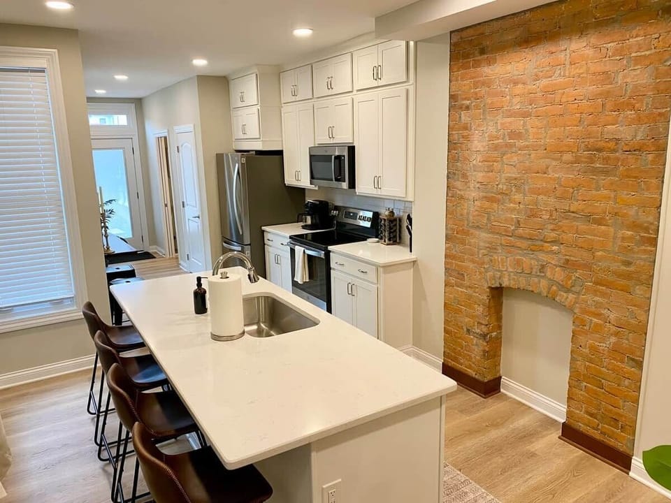 Kitchen / rear entrance / half-bath