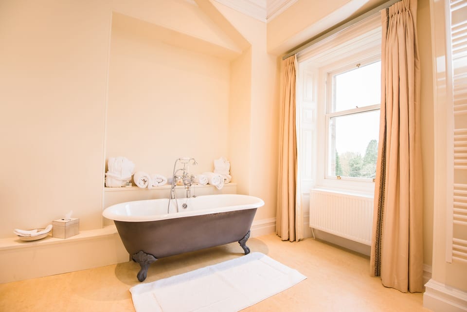 Honeymoon Suite | Bathroom | Hair dryer, towels
