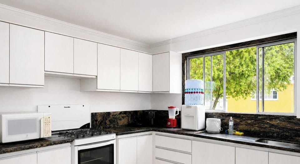 Honeymoon House, Pool Access, Garden View | Private kitchen | Fridge, microwave, cookware/dishes/utensils, dining table