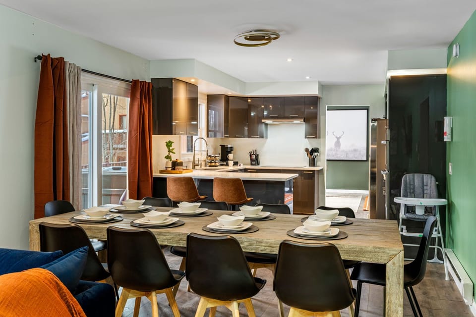 Dining area with fully equipped kitchen and family-friendly seating.