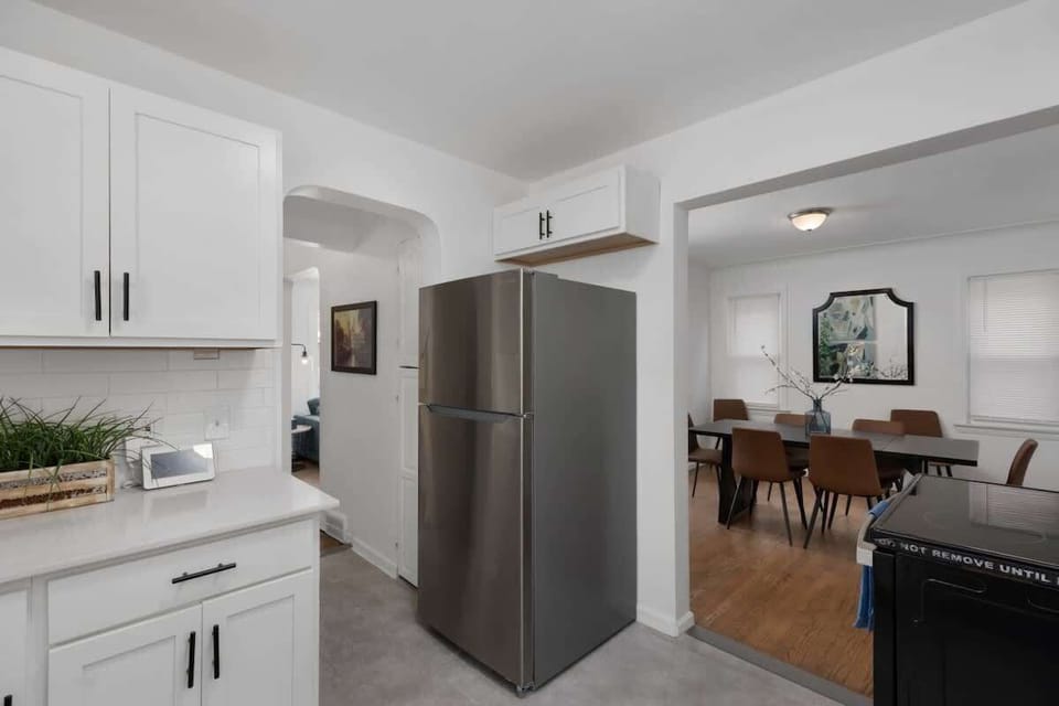 Fully equipped kitchen with stainless fridge