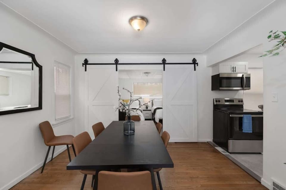 Dining area beside modern kitchen setup