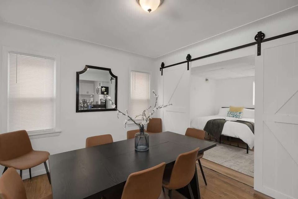 Dining space beside sliding barn doors
