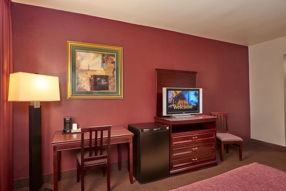 Work comfortably at the desk with convenient in-room mini fridge.