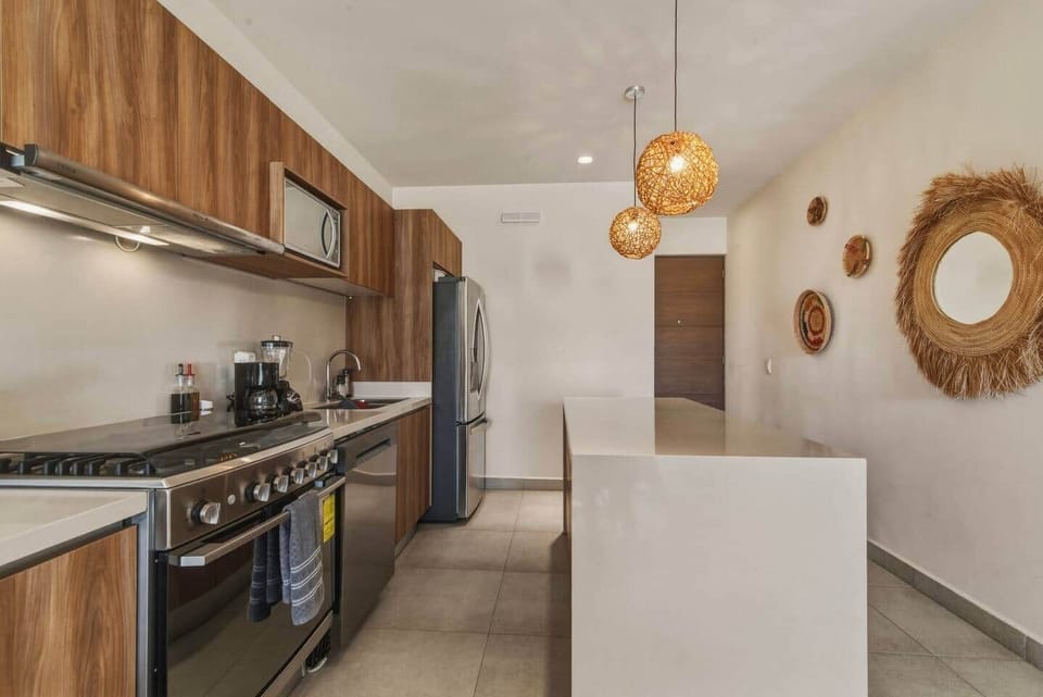 Fully equipped kitchen with everything you need to cook and enjoy a meal during your stay. Includes filtered drinking water and ice, a coffee maker with coffee, toaster, blender, microwave, dinnerware, basic spices, and a dishwasher for easy cleanup.
