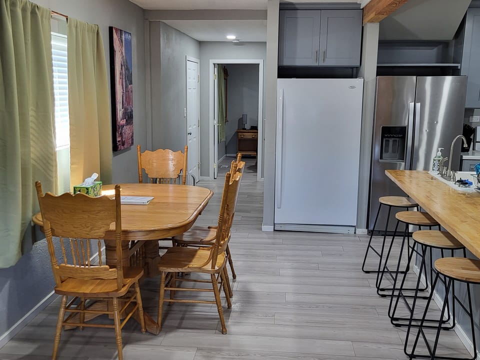 Dining area and bar seating for eight