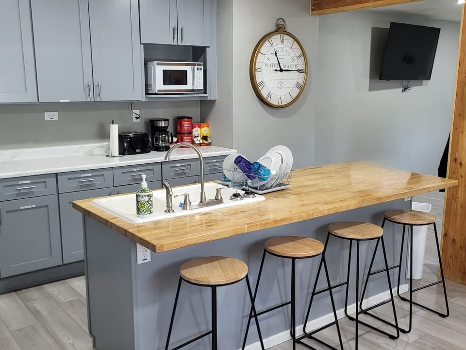 Central island with coffee bar and microwave