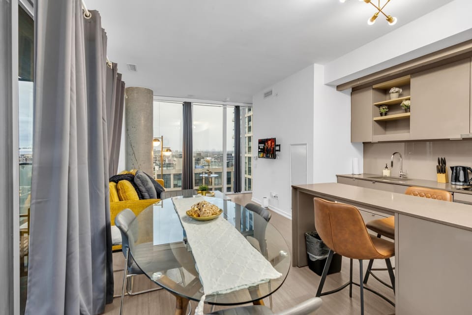 Deluxe Suite, 2 Bedrooms | Living area | 55-inch TV with digital channels