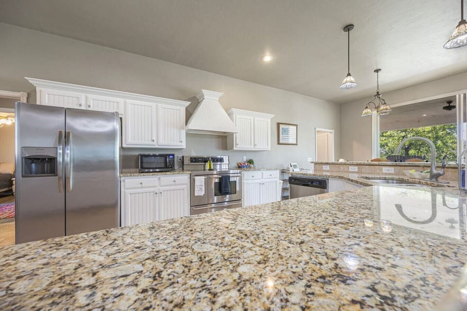 Spacious fully stocked kitchen with basic spices and cooking oil