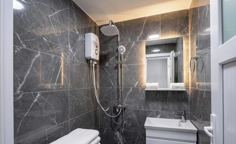 Economy Double Room, City View | Bathroom | Free toiletries, hair dryer, slippers, towels