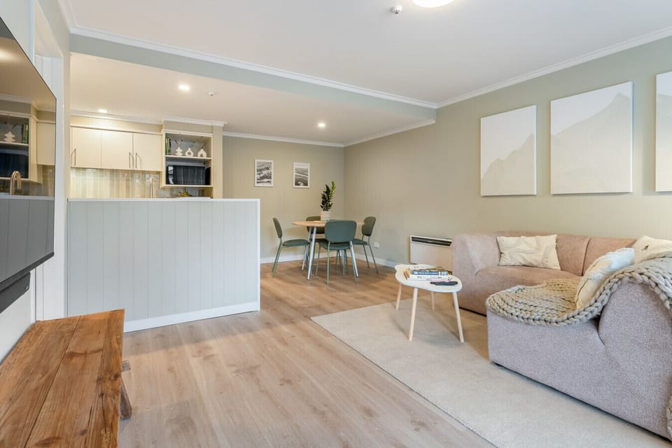 The full living and dining space - kitchen island, round dining table