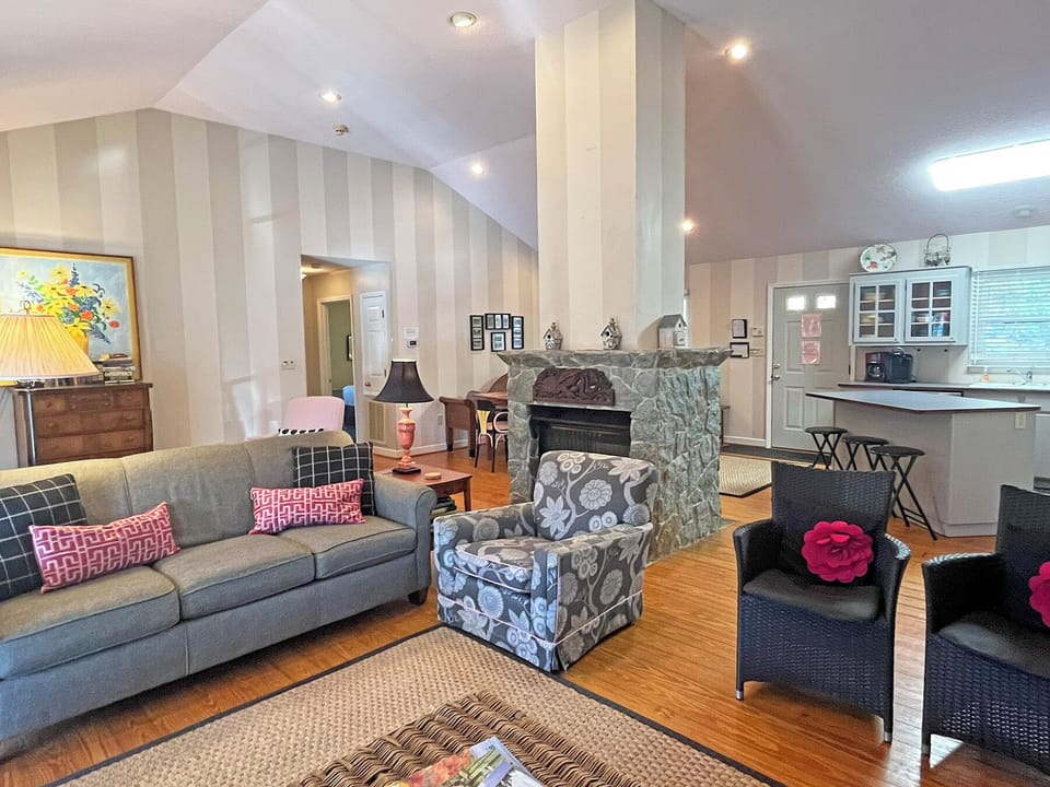 Great Room - Bright and airy great room,and double sided stone gas fireplace.